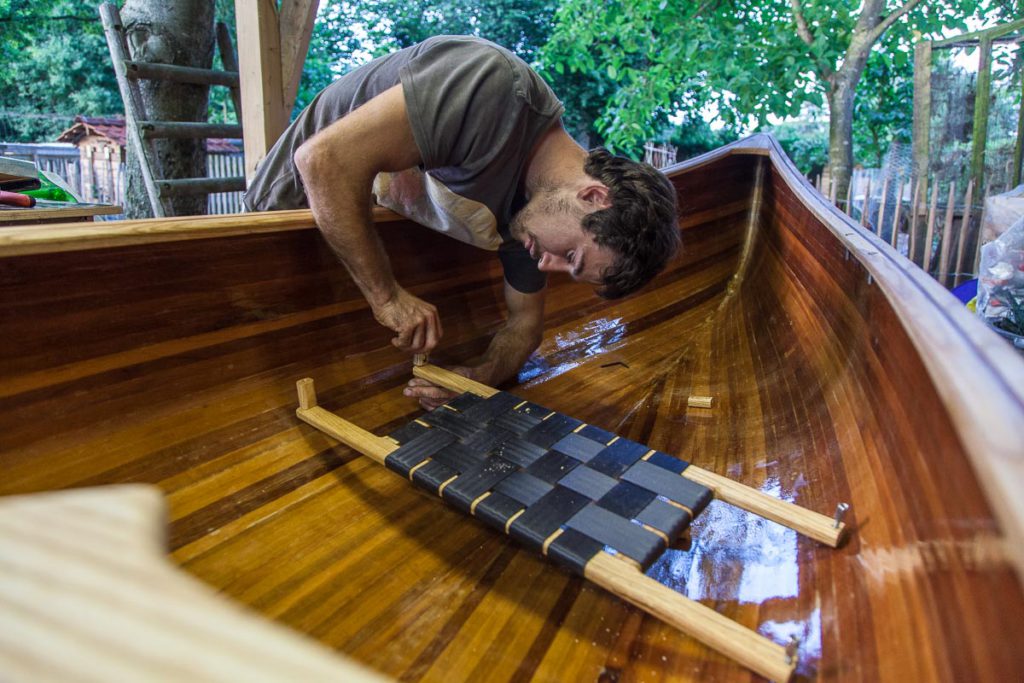 A wood strip canoe in need of revivification Johannes installing the seats A wood strip canoe in need of revivification