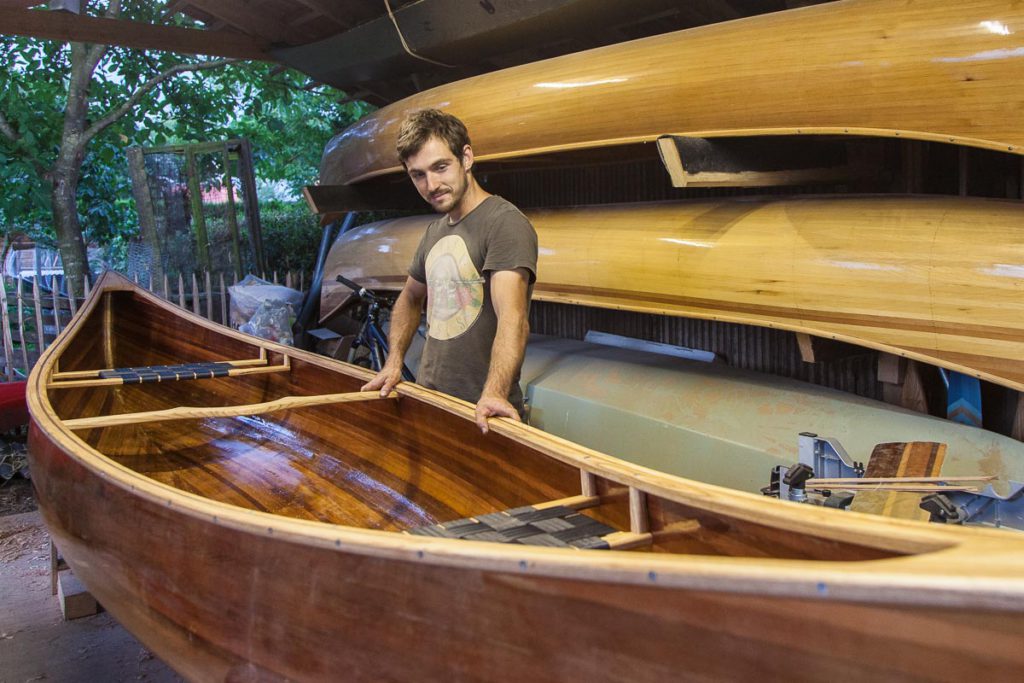 A wood strip canoe in need of revivification Johannes with his finished canoe A wood strip canoe in need of revivification