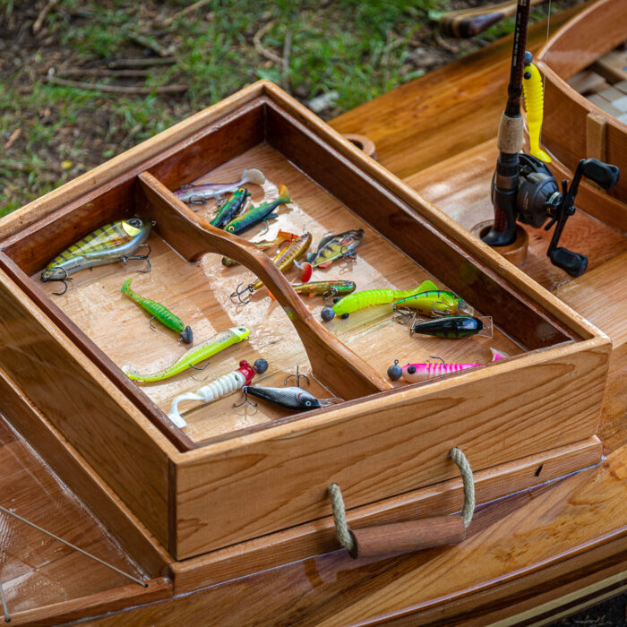 the tackle box of a wooden fishing canoe