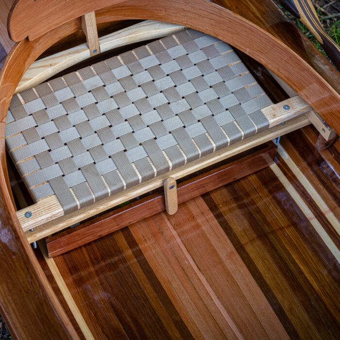 the seat of a wooden fishing canoe