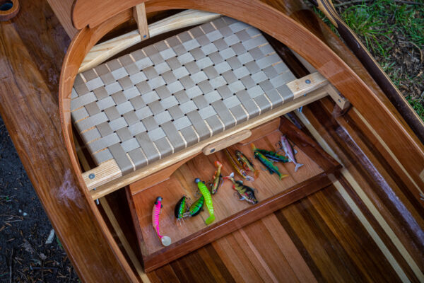 the seat of a wooden fishing canoe