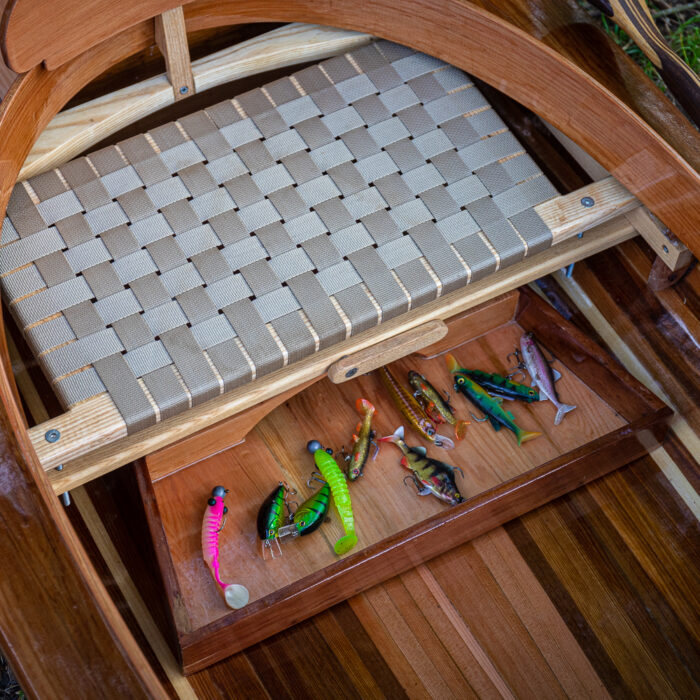 the seat of a wooden fishing canoe