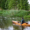 a wooden fishing canoe on the river