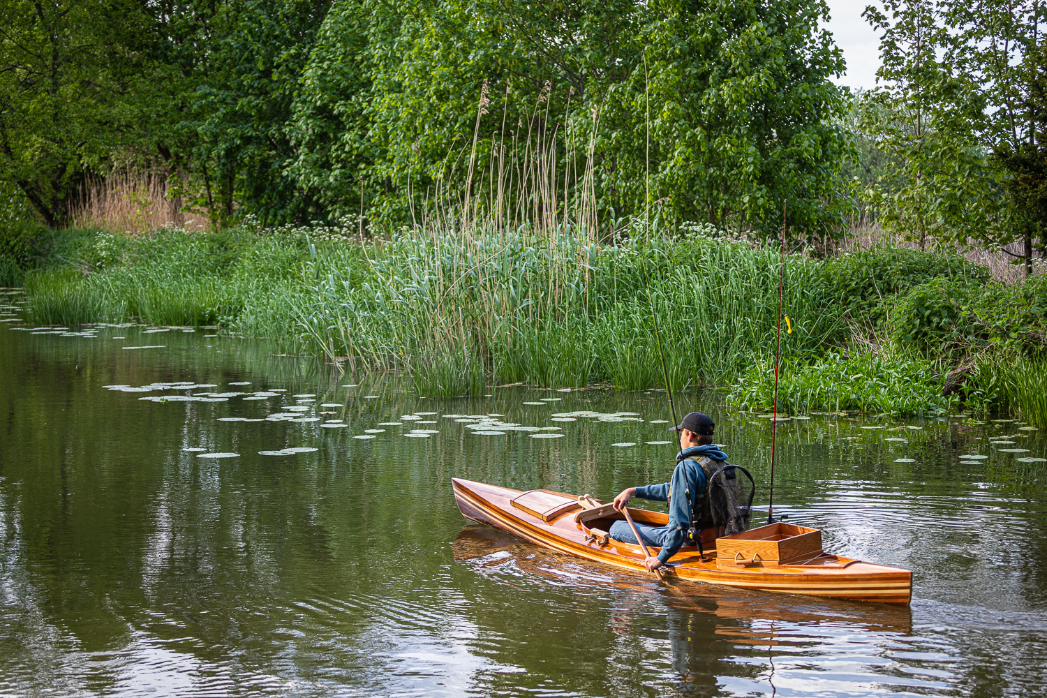 a wooden fishing canoe on the river