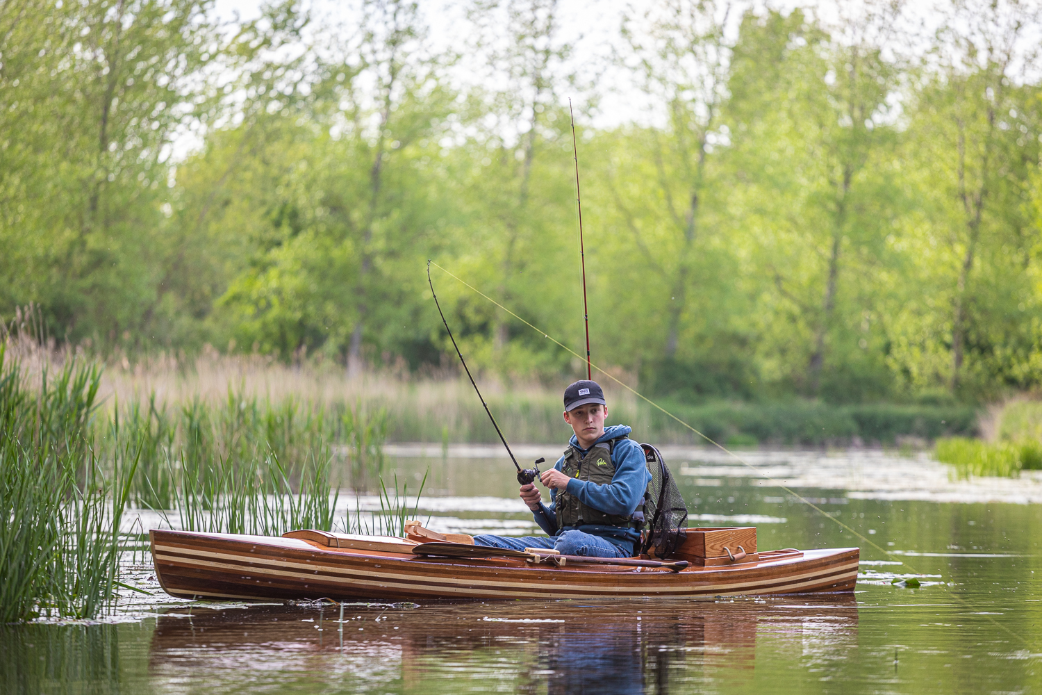 a wooden fishing canoe on the river