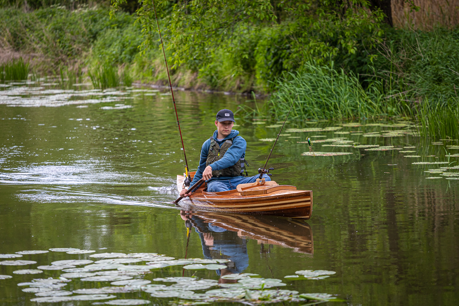 a wooden fishing canoe on the river
